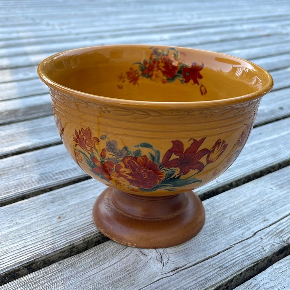 Vintage flower bowl on a wood pedestal